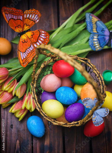 Easter background with tulips and painted eggs 