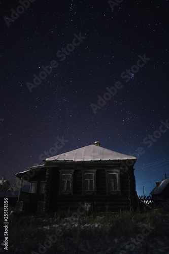 Sleeping houses in the village on a frosty and starry night in Russia