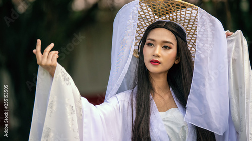 Obraz na plátně Close up portrait Beautiful Chinese woman white dress traditional, Beautiful and belligerent face; asian you woman in Chinese dress