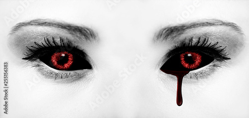 Evil black alien vampire or zombie eyes. Close up shot photo