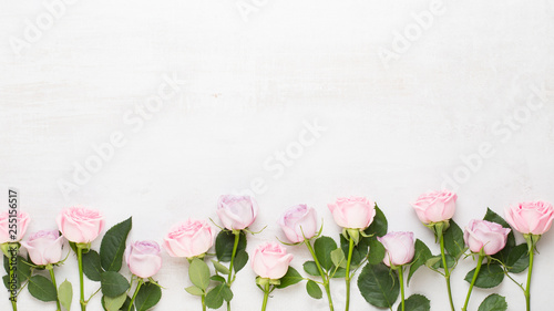 Flowers valentine day composition. Frame made of pink rose on gray background. Flat lay  top view  copy space.