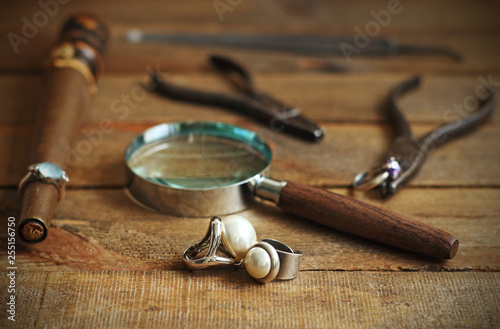 Silver and pearl rings and tools