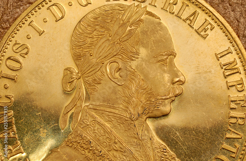Portrait of Franz Joseph I on obverse of old gold Austrian four ducats coin. photo
