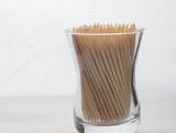 A toothpick in a dozen on a white background