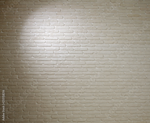 Background of white brick textured vintage wall with light pattern