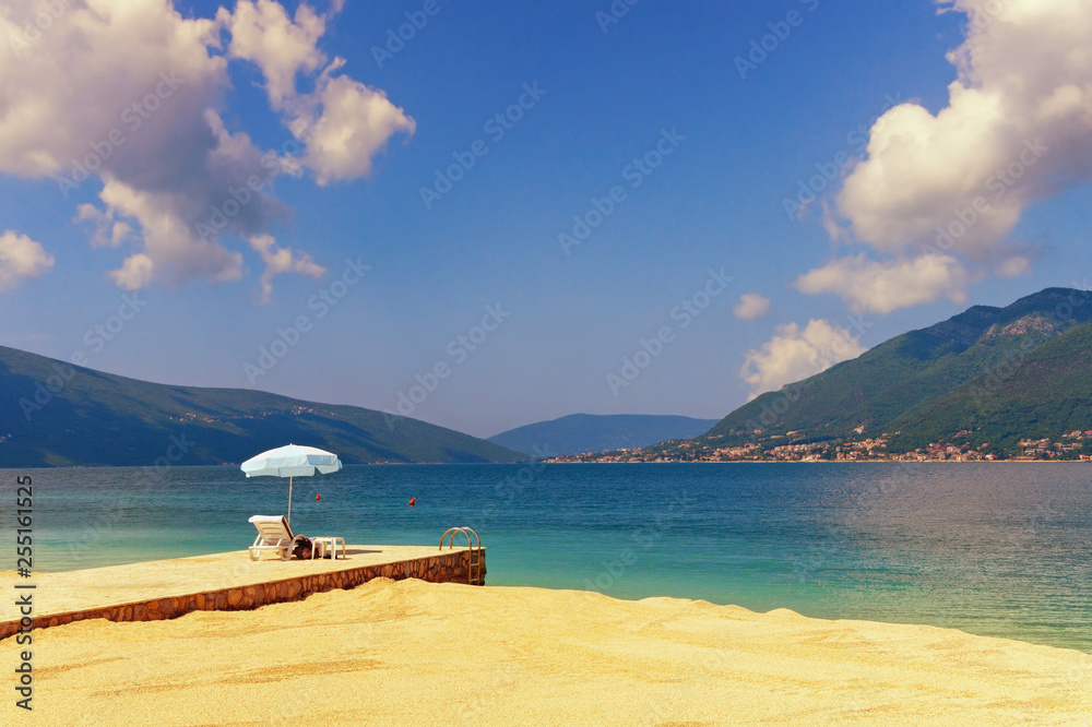 Obraz premium Vacation on the sea. Montenegro, Adriatic Sea, view of Bay of Kotor near Tivat city on sunny spring day