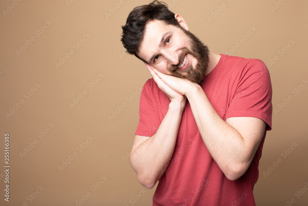 Young bearded man laughing, studio shot. Young bearded man laughing, studio shot.
