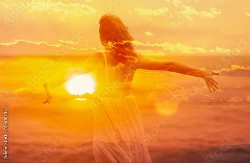 Photography Double exposure of young woman and sunset sky.