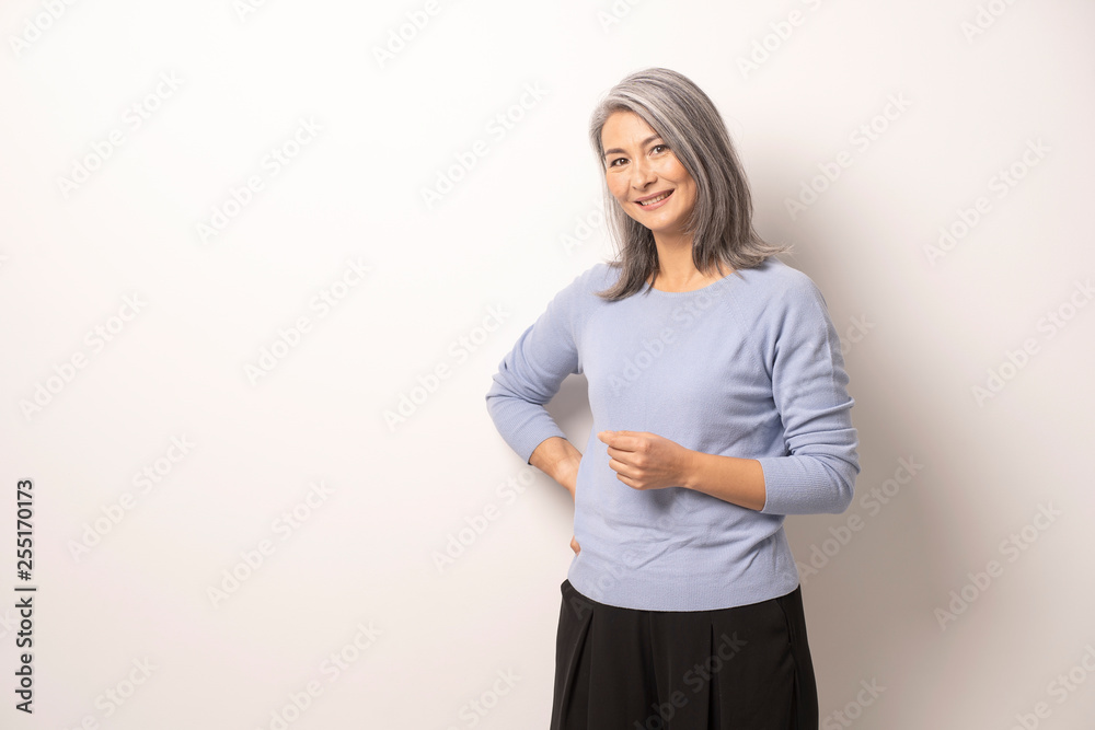 Mongolian beautiful Gray Haired Woman on a White Background. Mongolian beautiful Gray Haired Woman on a White Background.