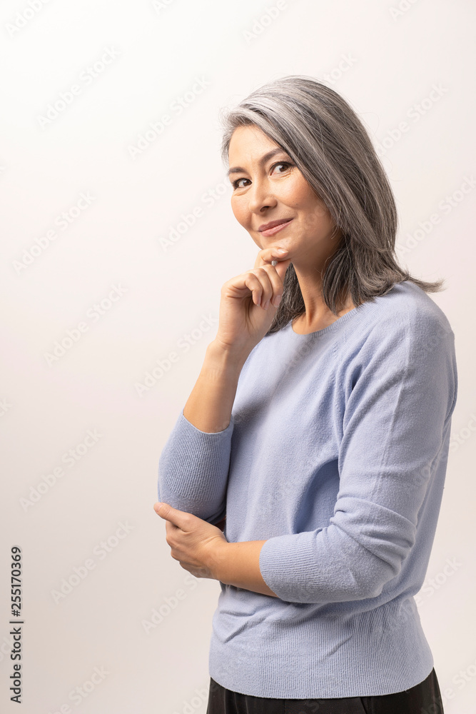 Mongolian elegant Gray Haired Woman on a White Background. Mongolian elegant Gray Haired Woman on a White Background.