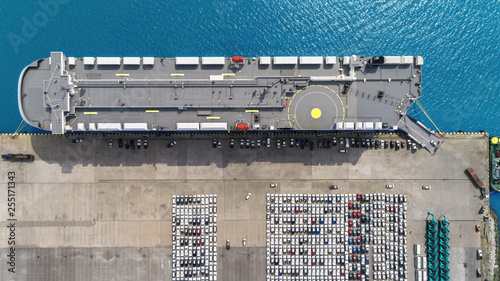 Aerial top view Large RoRo (Roll on/off) Car or Vehicle carrier vessel loading car for shipping to worldwide. 