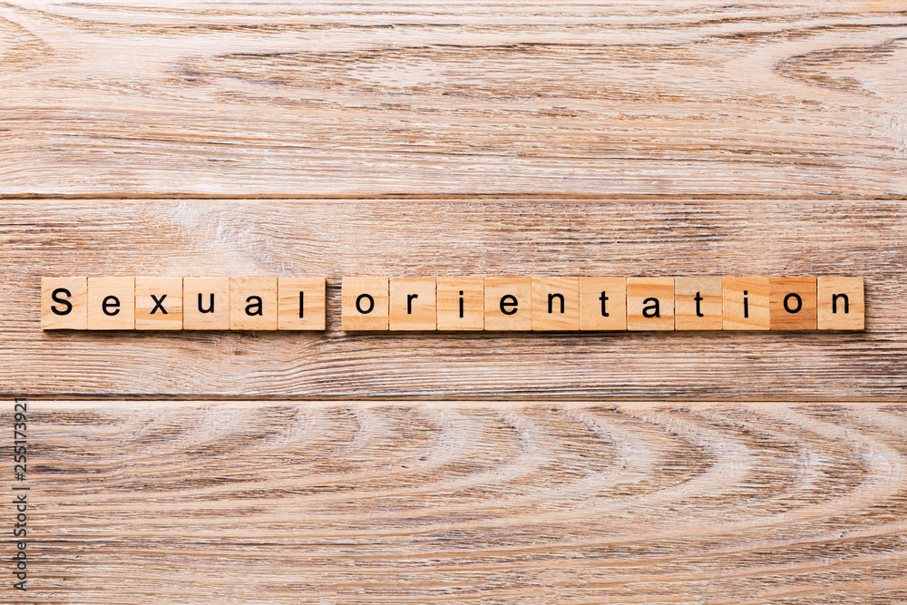 Fototapeta premium Sexual orientation word written on wood block. Sexual orientation text on wooden table for your desing, concept