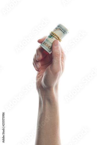 Man hand holding 100 Dollar bills isolated on white. Roll of US Dollars bank note