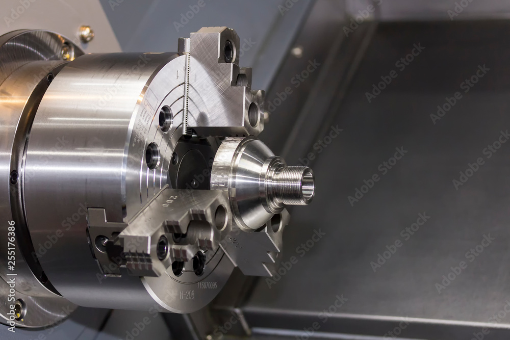Close up spindle chuck and product part set on high precision Cnc industrial lathe turning machine Close up spindle chuck and product part set on high precision Cnc industrial lathe turning machine