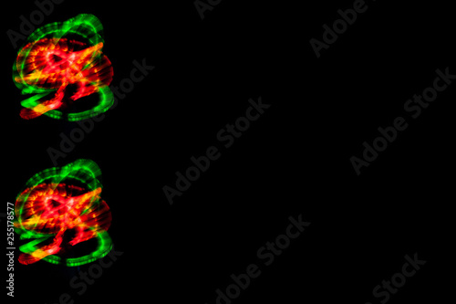 black background and light abstract patterns rainbow colorful, copy space, menu, freezelight drawing colored light