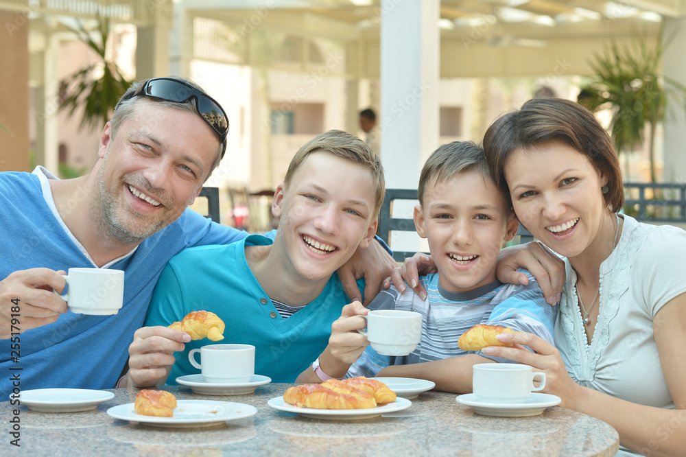 Portrait of happy family at breakfast on the table Portrait of happy family at breakfast on the table