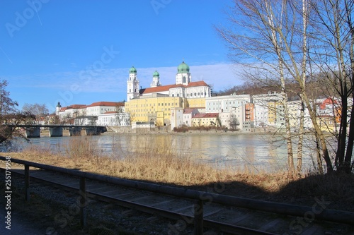 View of the Inn river and the old town of Passau, in February. Seen from the city district Innstadt. Railway tracks in the foreground. Bavaria, Germany, Europe.