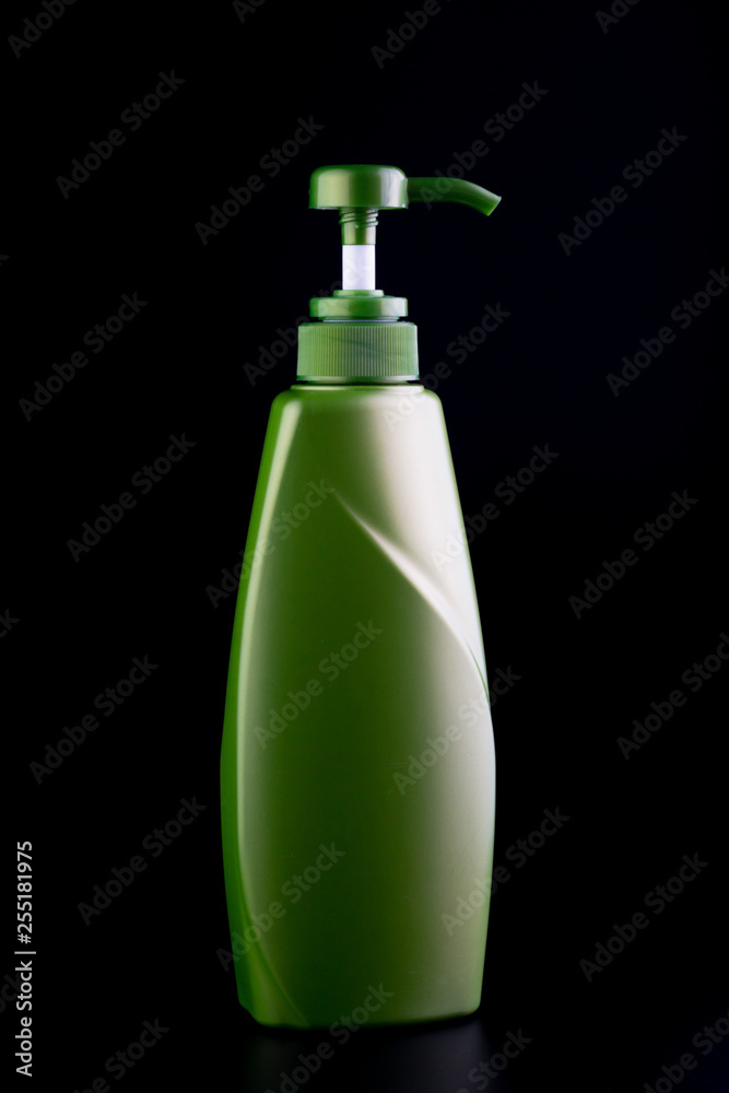 plastic container with pump on black background. plastic container with pump on black background.