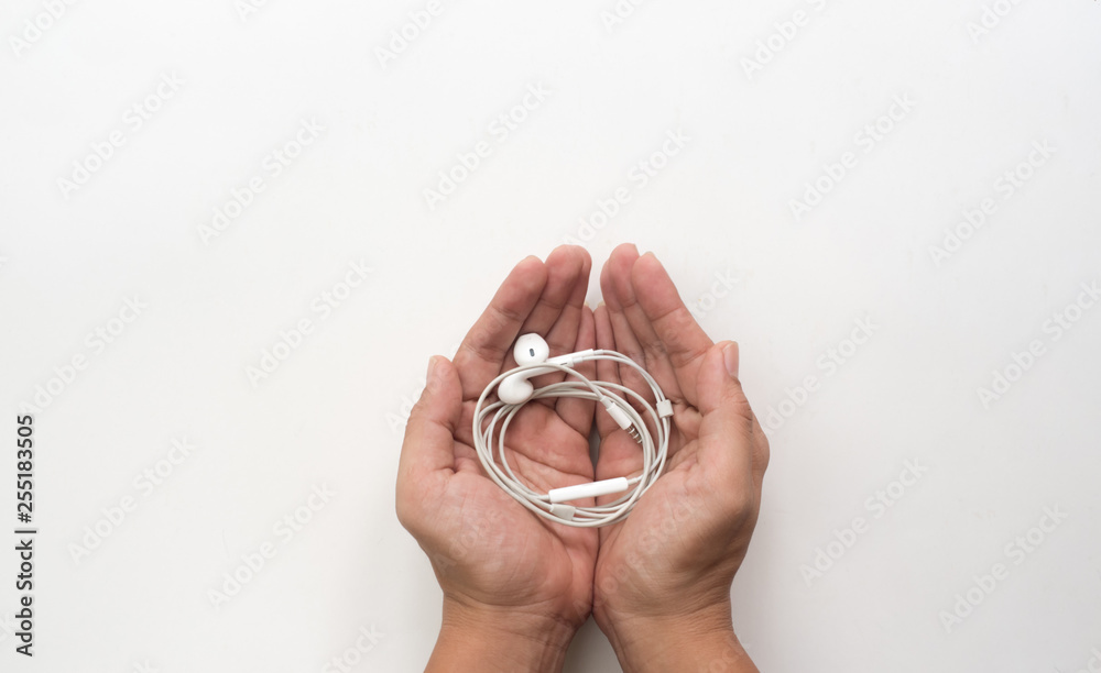 hand hold Earphone on white background
