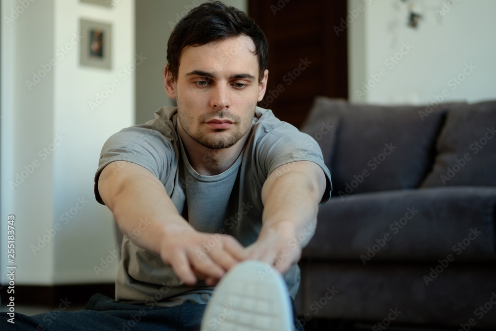 A man doing exercises at home. Healthy lifestyle concept. A man doing exercises at home. Healthy lifestyle concept.