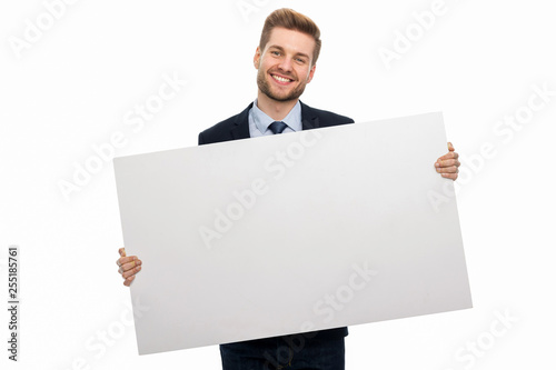 Business man holding white board