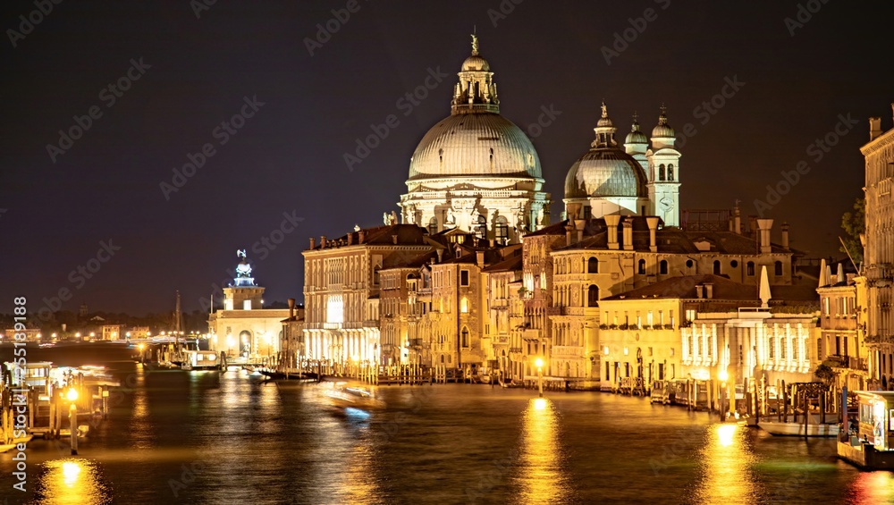 Italy beauty, night Grand canal and cathedral Santa Maria della Salute taken from Academia bridge in Venice, Venezia