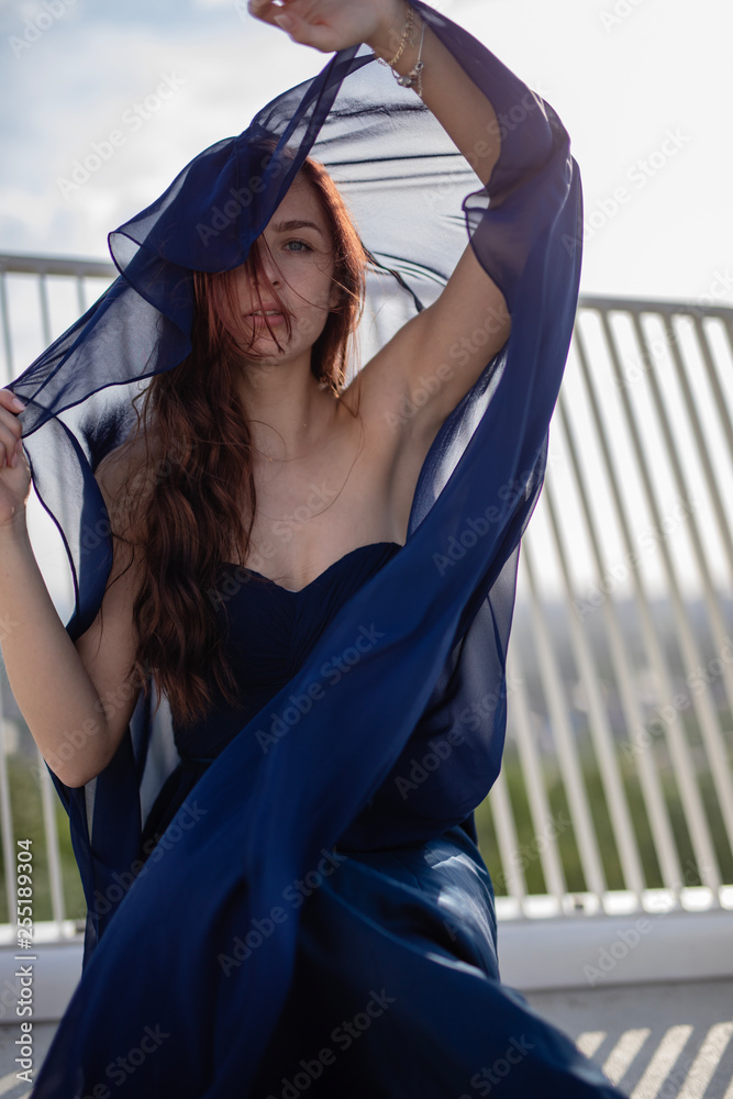 young woman in nice dress around berlin 