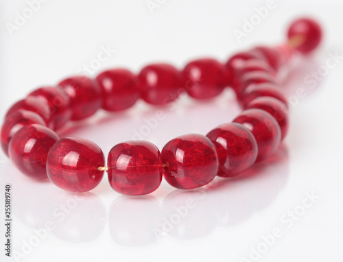 Stone bracelet red with white background. 