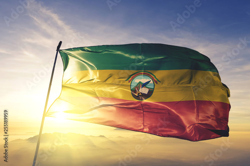 San Marcos department of Guatemala flag waving on the top sunrise mist fog photo