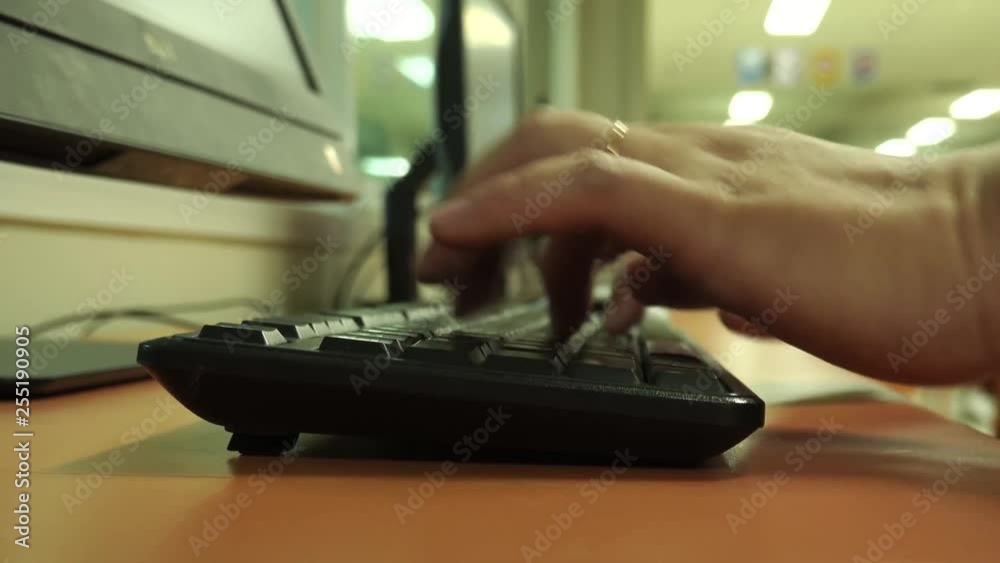 Close up man hands typing on keybord in office, fingers keypad. Very shallow depth of field. Close up man hands typing on keybord in office, fingers keypad. Very shallow depth of field.