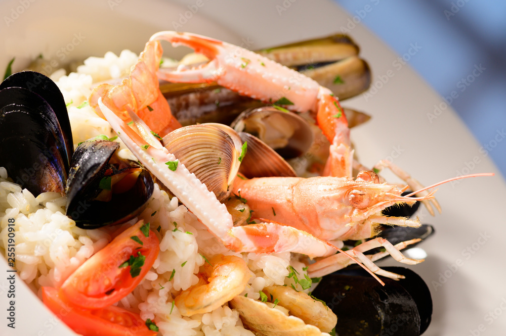 Rice with seafood on a plate in restauant ready to be served
