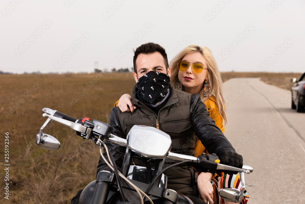 Beautiful young couple traveling Motorbike