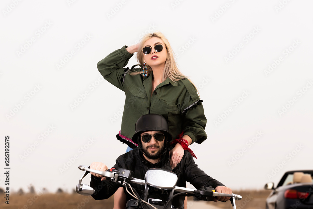 Beautiful young couple traveling Motorbike