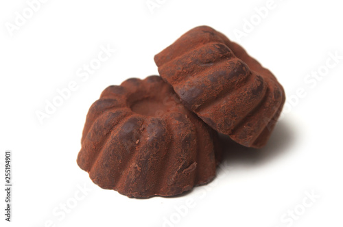 Closeup of chocolate truffles in shaped Kougelhopf on white background