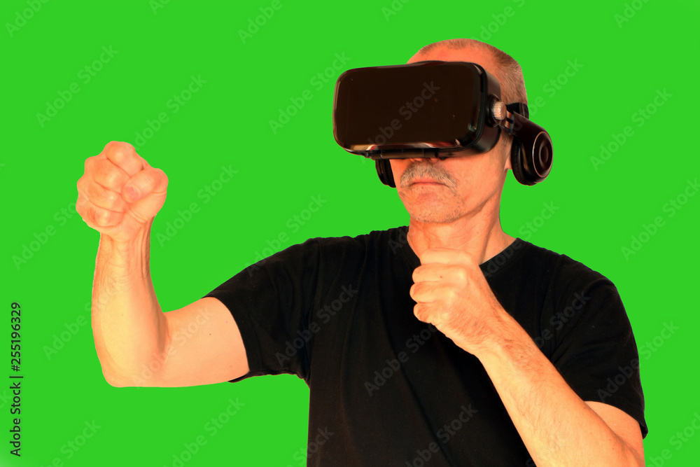 Close-up of a man in a black T-shirt with glasses of virtual reality. Close-up of a man in a black T-shirt with glasses of virtual reality.