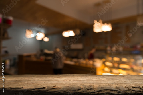 blurred background of bar and dark brown desk space of retro wood