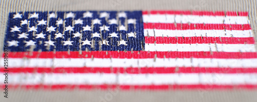 American flag on a t-shirt of a us army soldier. Selective focus.