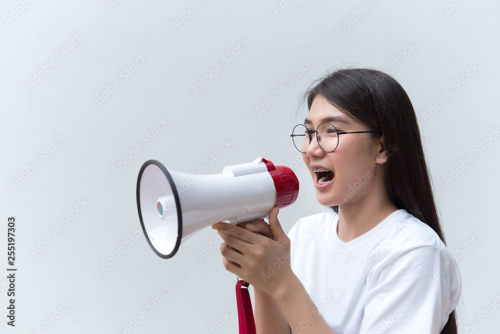 Beautiful asian woman with speaker in hand on white background,angry woman concept,Thailand people Beautiful asian woman with speaker in hand on white background,angry woman concept,Thailand people