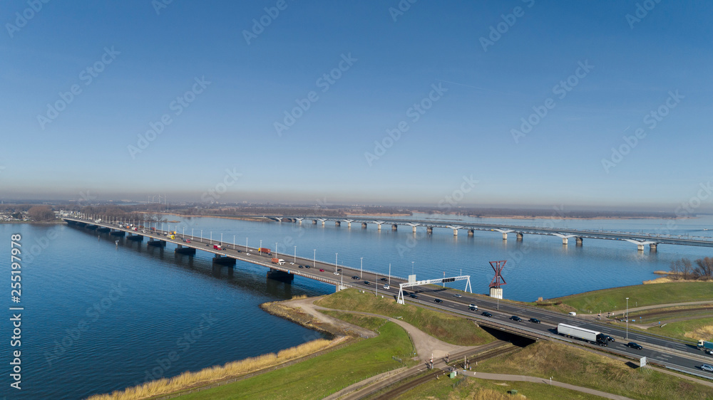Aerial view of bridge MOERDIJK BRUGGEN over the river HOLLANDSCH DIEP in Holland. Those bridges connect the provinces of Zuid-Holland and Noord-Brabant Aerial view of bridge MOERDIJK BRUGGEN over the river HOLLANDSCH DIEP in Holland. Those bridges connect the provinces of Zuid-Holland and Noord-Brabant