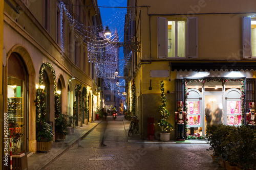 View on lanes with Christmas illumination in night Parma of Italy