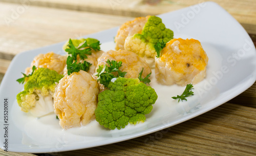 Fish balls with white sauce, broccoli, greens