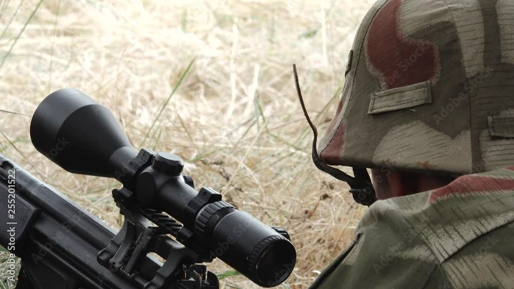 Close Young sniper aims target