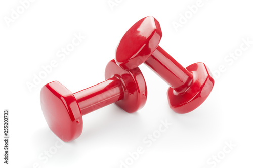 Two red dumbbells isolated on white background