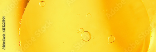 Yellow bubbles and drops of oil background, kitchen pattern, orange beverage background.