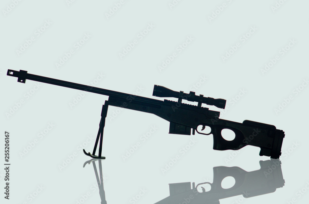 military weapons. toy on a plain background military weapons. toy on a plain background