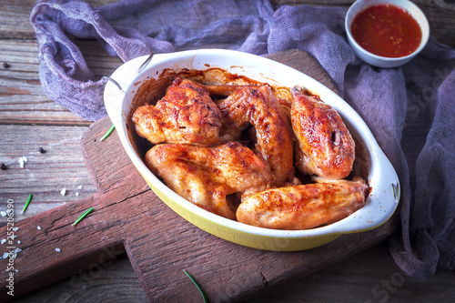 Chicken Wings, Oven Baked and Grilled. Homemade Tasty Food. Wood Table Background, Rustic Still Life Style