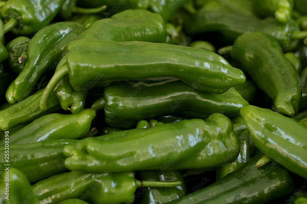 Coarse and green peppers in the fruit market Coarse and green peppers in the fruit market