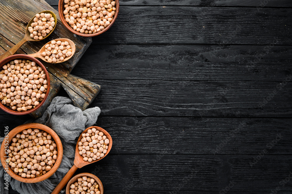 Raw Turkish Pea. Nut. On a black background. Top view. Free copy space.