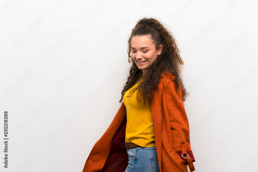Happy Teenager girl over white wall. Happy Teenager girl over white wall.