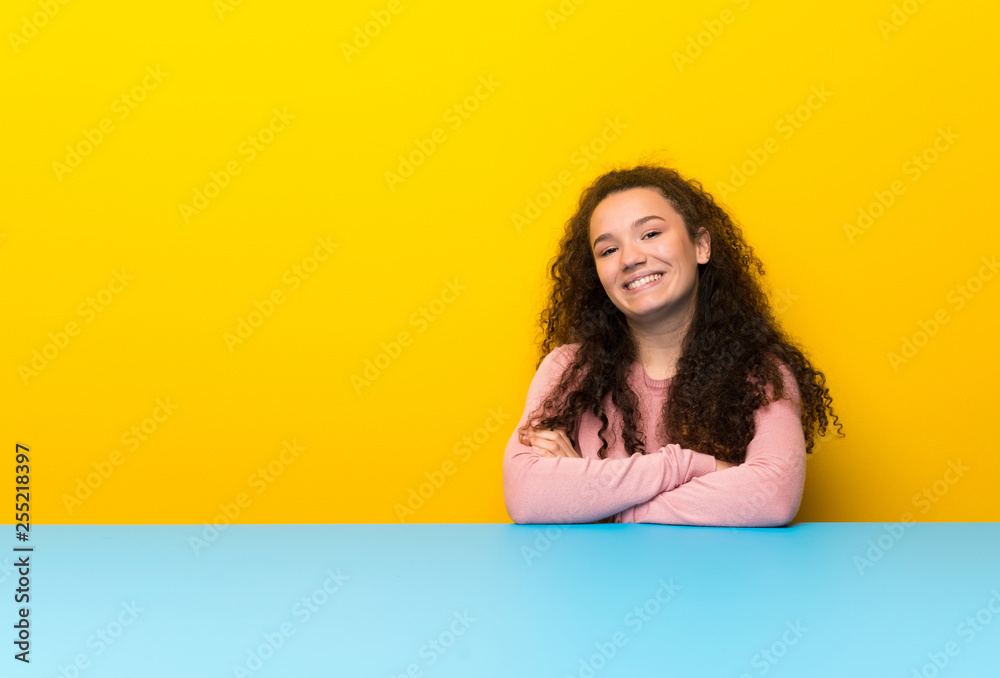 Teenager girl keeping the arms crossed in frontal position Teenager girl keeping the arms crossed in frontal position